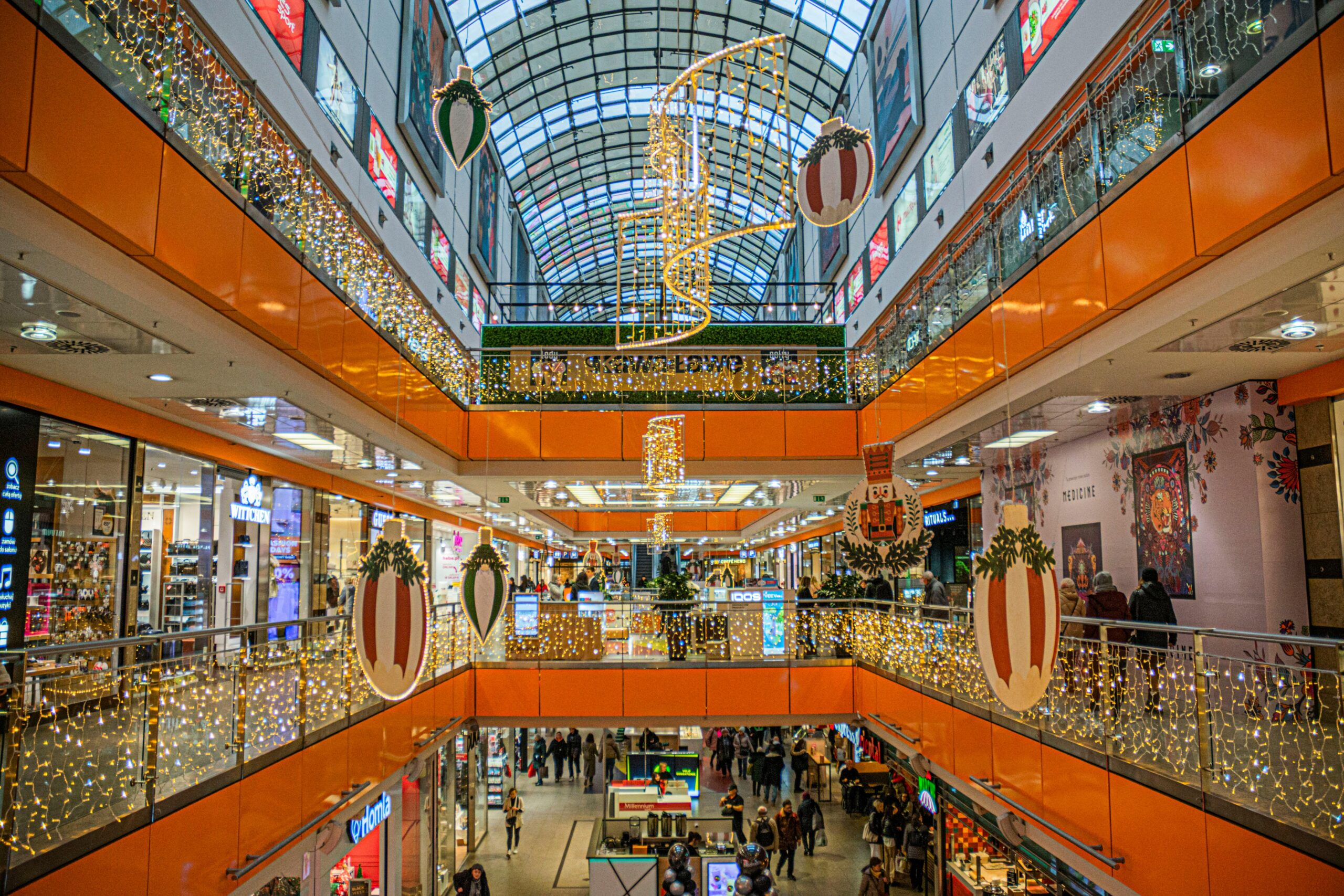 South African fashion retail store interior with shoppers browsing seasonal merchandise.