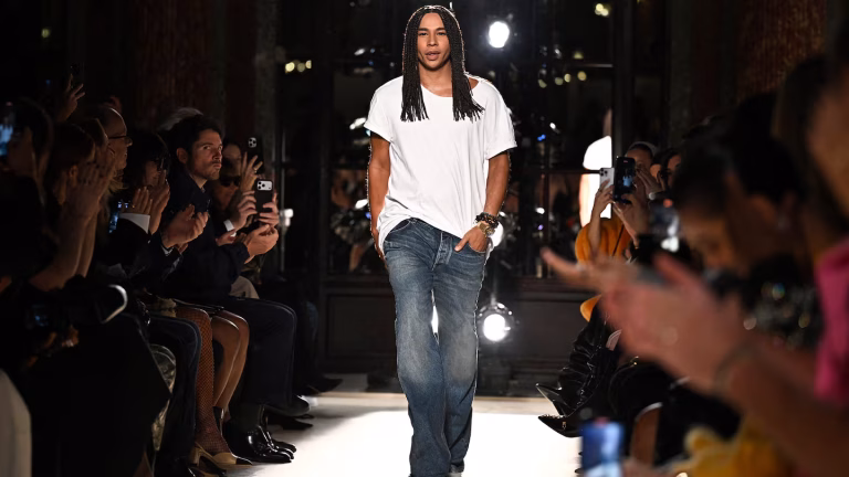 Olivier Rousteing at Balmain runway finale, Paris Fashion Week.