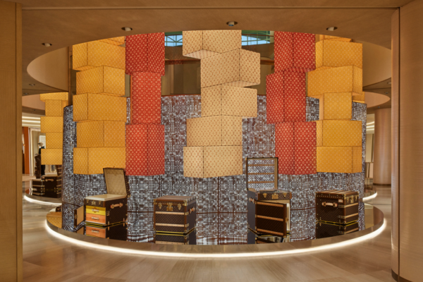 Experiential retail space inside Louis Vuitton concept-store blending design, hospitality, and fashion.