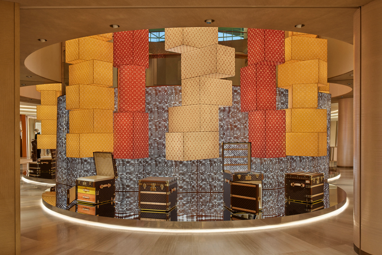 Experiential retail space inside Louis Vuitton concept-store blending design, hospitality, and fashion.
